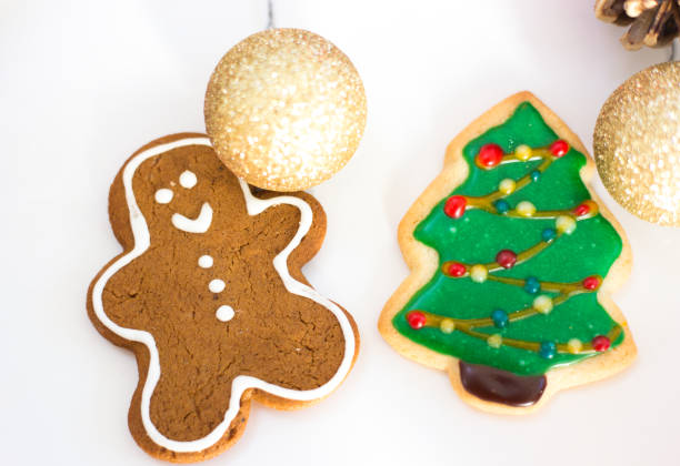 istock Two Homemade Christmas Cookies: Gingerbread Man, Christmas Tree 2189092605