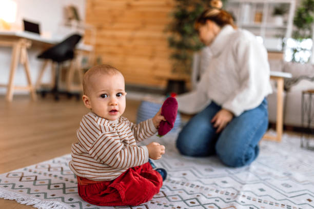 istock Baby and mother playing at home 2189093743