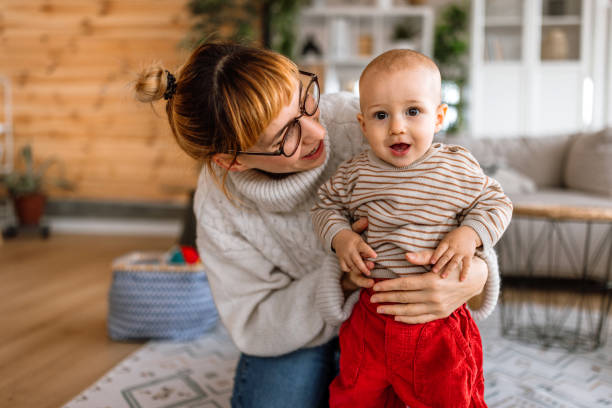 istock Mother playing with cute little baby son 2189093795