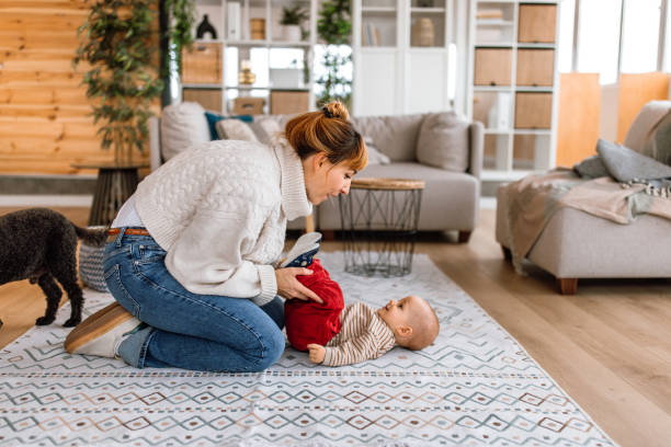 istock Mother is playing with her cute baby son at floor 2189093838