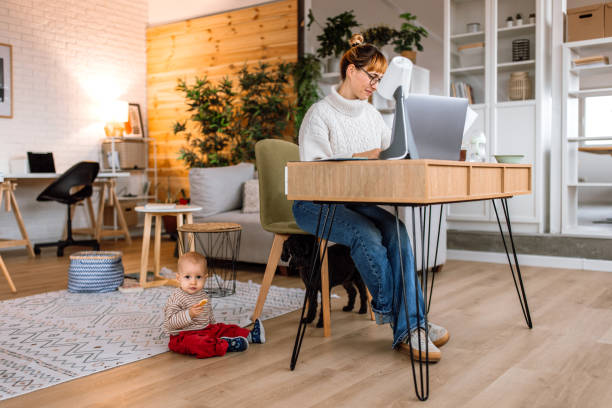 istock Multitasking mother working and taking care of her baby 2189093841
