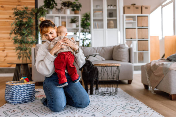 istock Mother holding cute little baby boy 2189093867