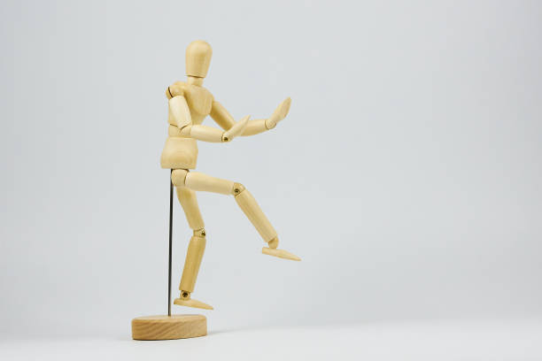 istock Dancing and fun concept, wooden figure performing dance moves 2189094013