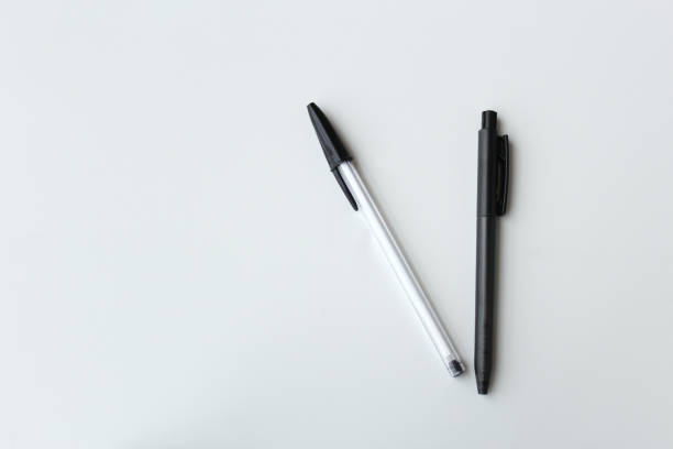 istock Two black and white ballpoint pens isolated with space for copy. 2189094140