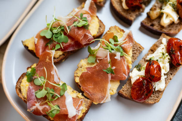 istock Bruschetta with sourdough bread, scrambled eggs and prosciutto 2189094314