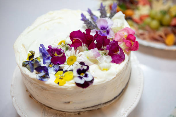 Chocolate cake covered with cream and decorated with edible flowers - Buenos Aires - Argentina