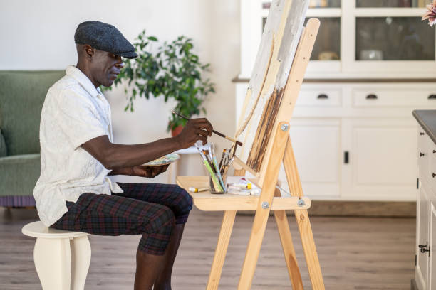 istock A male senior citizen painting 2189100296