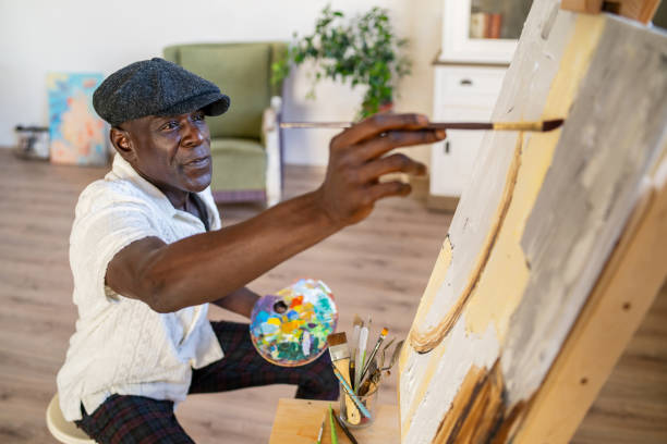 istock A senior man painting for a hobby 2189100316