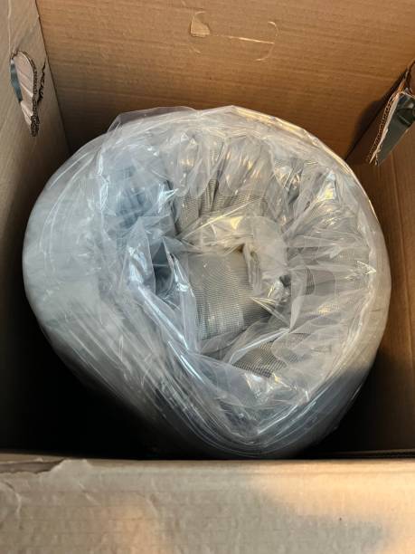 istock New Mattress Curled up in its Box 2189103179