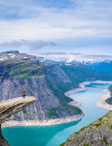 istock A Solitary Figure on Norway's Trolltunga, Norway 2189103253