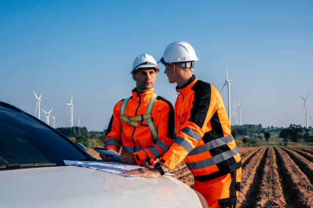 istock Two engineers working at wind turbine farm 2189106606