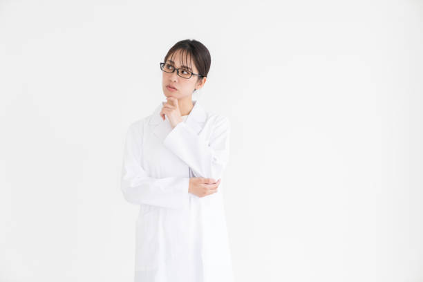 istock attractive asian woman in a white coat, trouble 2189111870