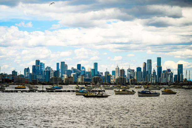 Williamstown, Melbourne, Vic, Australia-12,01,2024: Melbourne skyline - the shot taken from Williamstown on a cloudy day, boats in yarra river in the foreground and the city skyline in the backgroud.
