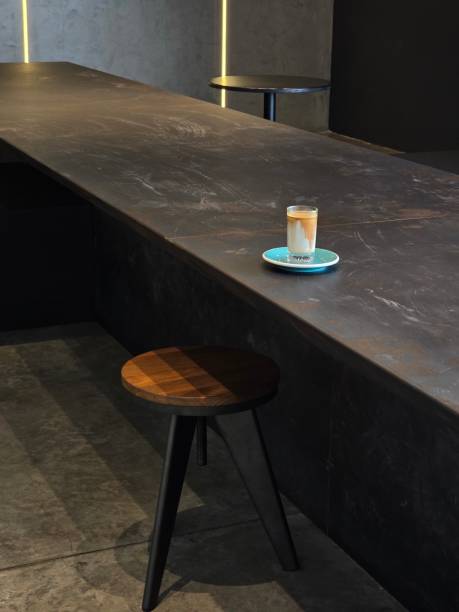 Artistic Latte in Black Mug on Wooden Table, Latte art barista design