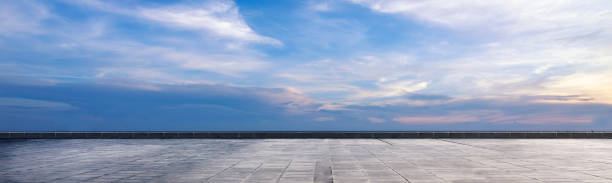 istock Cement floor view with blue sky and clouds in the background 2189118111