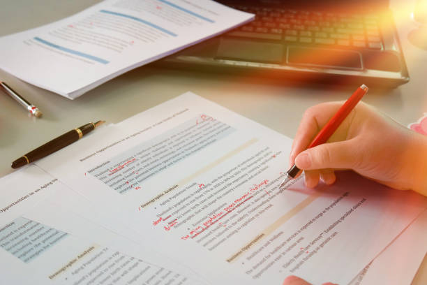 English proofreading paper in office English proofreading article on table in business service station proof reading documents stock pictures, royalty-free photos & images