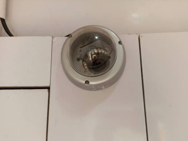 istock CCTV with a round cover mounted on the wall 2189120910