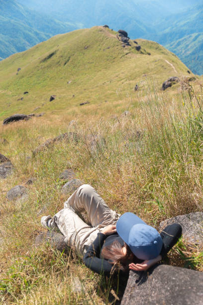 istock Hiker asian  backpack walking trail activity camping outdoors and People exploring forest green natural capturing beauty nature outdoor. 2189121331