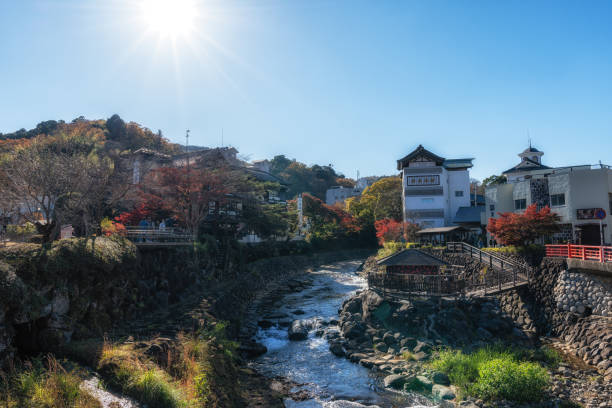 Tokko no Yu public footbath in Shuzenji, Japan with the view of Katsura River and nearby ryokans. Taken on December 3rd 2024