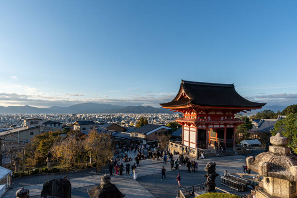 Kiyomizudera Shoro Bell Tower Sunset View with tourist crowded around. Taken in Kyoto, Japan on November 19 2024