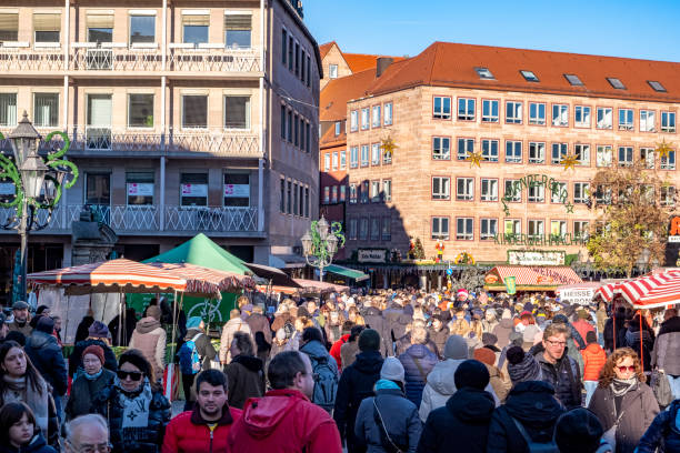 11/30/2024, Nuremberg, Germany. At the Nuremberg Christmas Market people are happily browsing, shopping and eating snacks. The Nuremberg Christmas Market is considered world famous.
