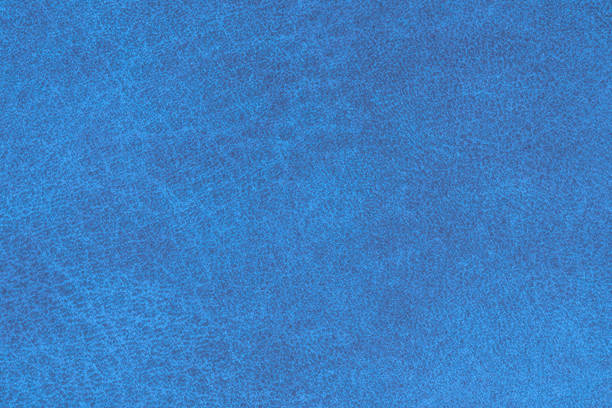 Blue color abstract textile pattern for background. Close-up detail macro photography table top view of lapis colour surface fabric material, cerulean colored background texture of cloth for design