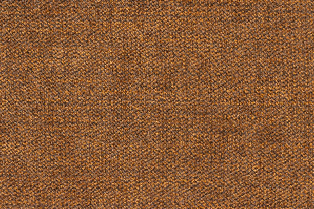 A highly detailed macro image focusing on knitted fabric showcasing colorful textured yarn close-up. The composition features harmonious gradient shades of purple and beige, highlighting soft material craftsmanship and artistic design patterns.