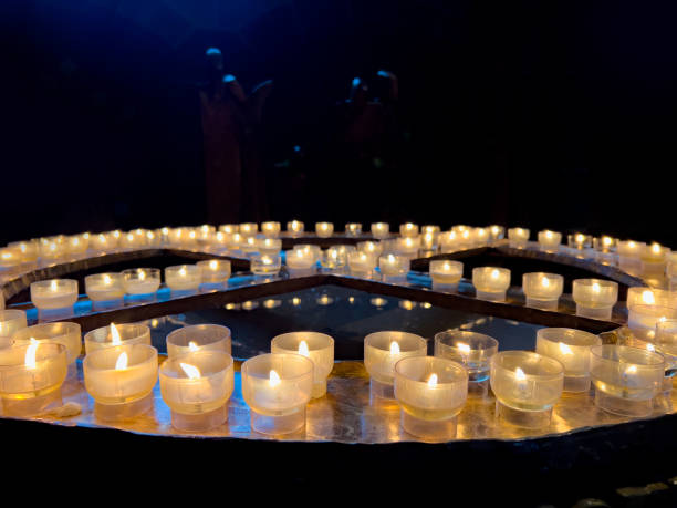 Candle lighting corner in the church where offerings are made and requests are made.
