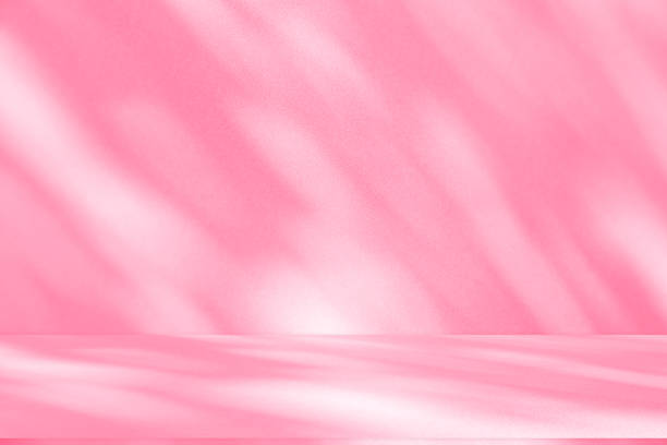 istock Wall interior background, studio, and backdrops show products. with shadow from window color white and pink light. background for text insertion and presentation of product 2189125425