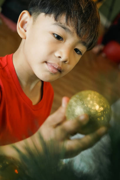 Close-up Boy Decoration Christmas tree at home
