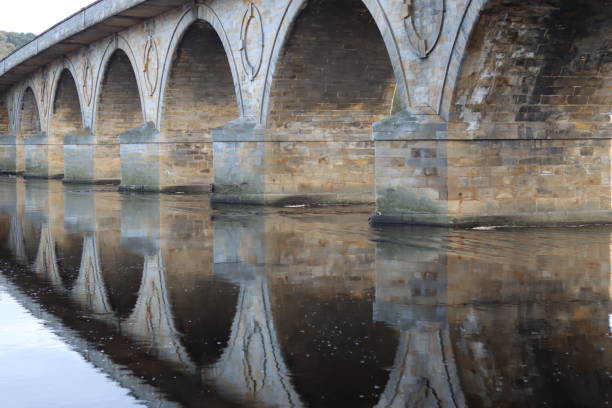 Bridge of the medieval village of Puebla de Sanabria reflected in the river Tera, Zamora, Castilla y León, Spain.