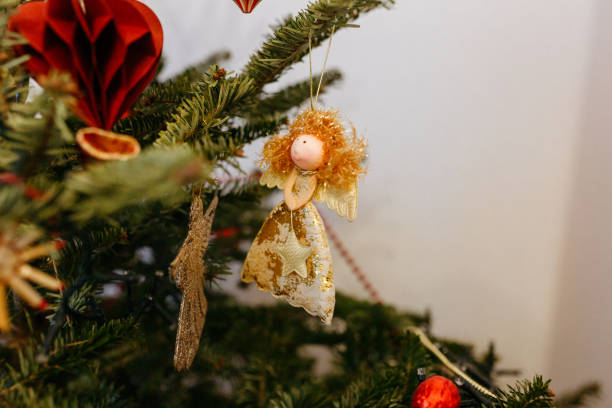 christmas tree decorated with angel and ornaments