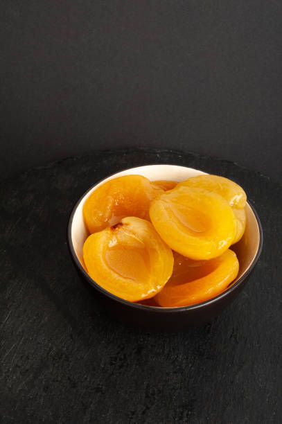 istock Canned Peaches, Apricot Halves in Syrup, Yellow Fruit Dessert, Tinned Nectarine Compote 2189132932