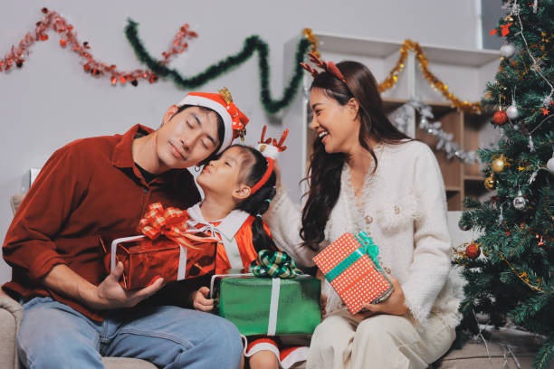 istock Father, mother and child celebrating Christmas. 2189135911
