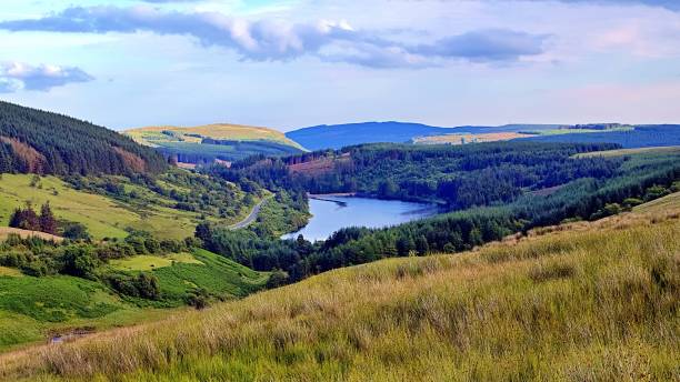 istock Scenic Valley with Forest and Lake Panorama 2189135950