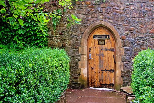 istock Charming Stone Arch Doorway Surrounded by Lush Greenery 2189135954
