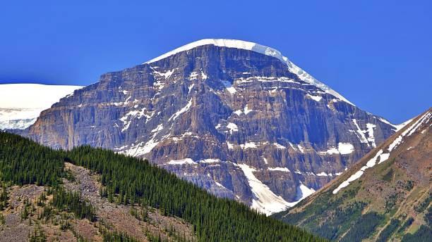 istock Majestic Snow-Capped Mountain Peak Under Clear Blue Sky 2189135991