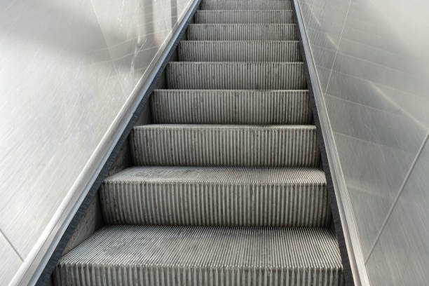 istock Escalator steps, moving staircase, empty metro elevator, electric stairway, metallic moving stairs 2189142128