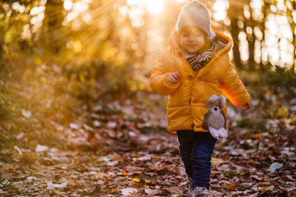istock Girl walking in the forest during sunny day 2189143928
