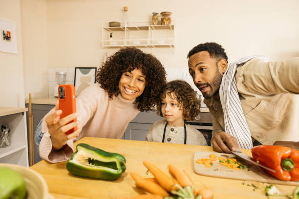 istock Family taking a selfie while cooking together in the kitchen 2189145240
