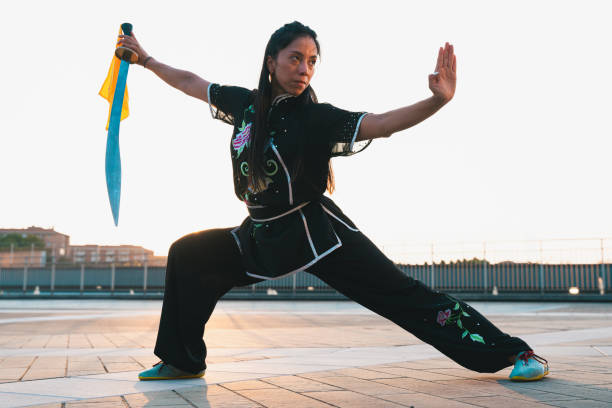 istock Chinese young woman practicing wushu kung fu. 2189148579