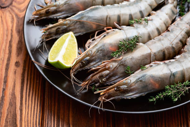 istock Raw big tiger ( king ) shrimps photography . Top view 2189148682