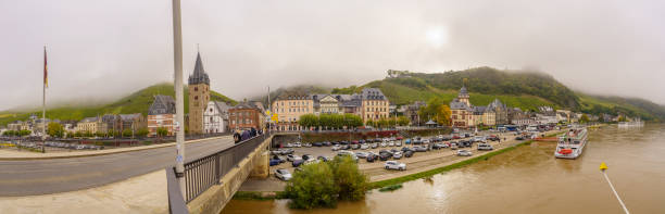 Bernkastel-Kues, Germany - October 12, 2024: Panoramic view of the Moselle River and the town Bernkastel-Kues, with locals and visitors, Rhineland-Palatinate, Germany