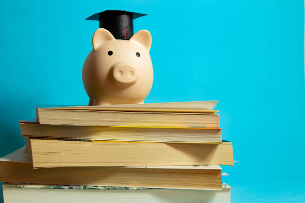 istock Piggy bank on stacked books 2189149563