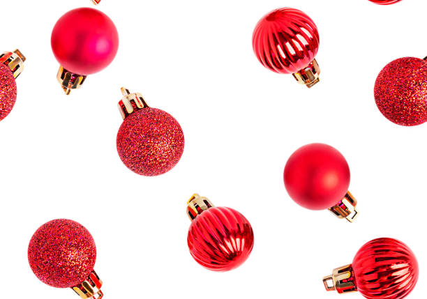 Seamless pattern made of traditional glittering bright red christmas baubles or new year tree decoration isolated on white background used as winter holiday ornament background as greeting decor