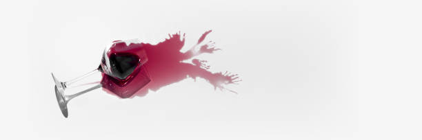 istock Spilled glass of red wine mockup with intricate reflections and unique splash pattern, offering bold and artistic visual. Negative space for to insert text, brand name. 2189150412