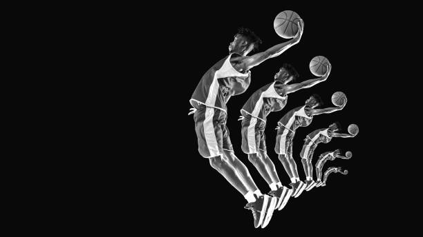 istock Player captured mid-leap holding basketball, black and white effects. Stroboscopic effect breaks down phases of jump, creating a dynamic action display. 2189150961