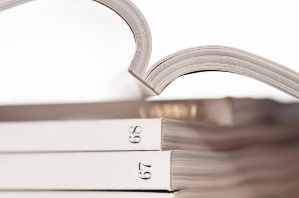 A book is open to page number 67, 68. The pages are white and the book is rectangular