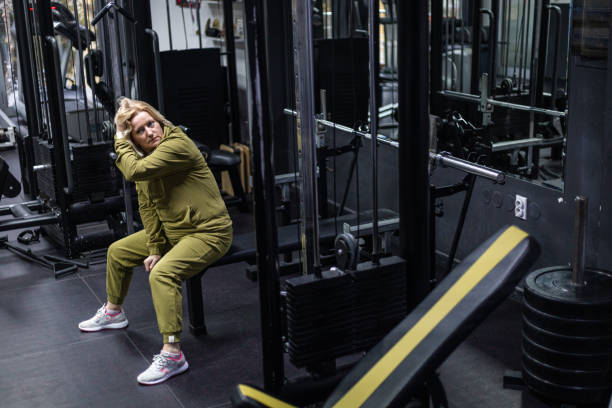 istock Senior Woman Reflecting During a Gym Session on a Bench 2189151855