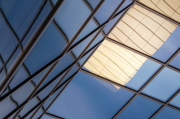 reflection with distortion in the window of a modern building color blue abstract urban background